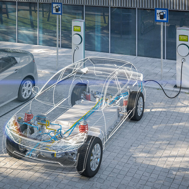 Elektro Auto als gläsernes Chassi an der Ladesäule 